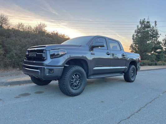 A '14 - '21 Toyota Tundra Crewmax & Doublecab with LED retrofit kit installed, parked on the side of the road at dusk.